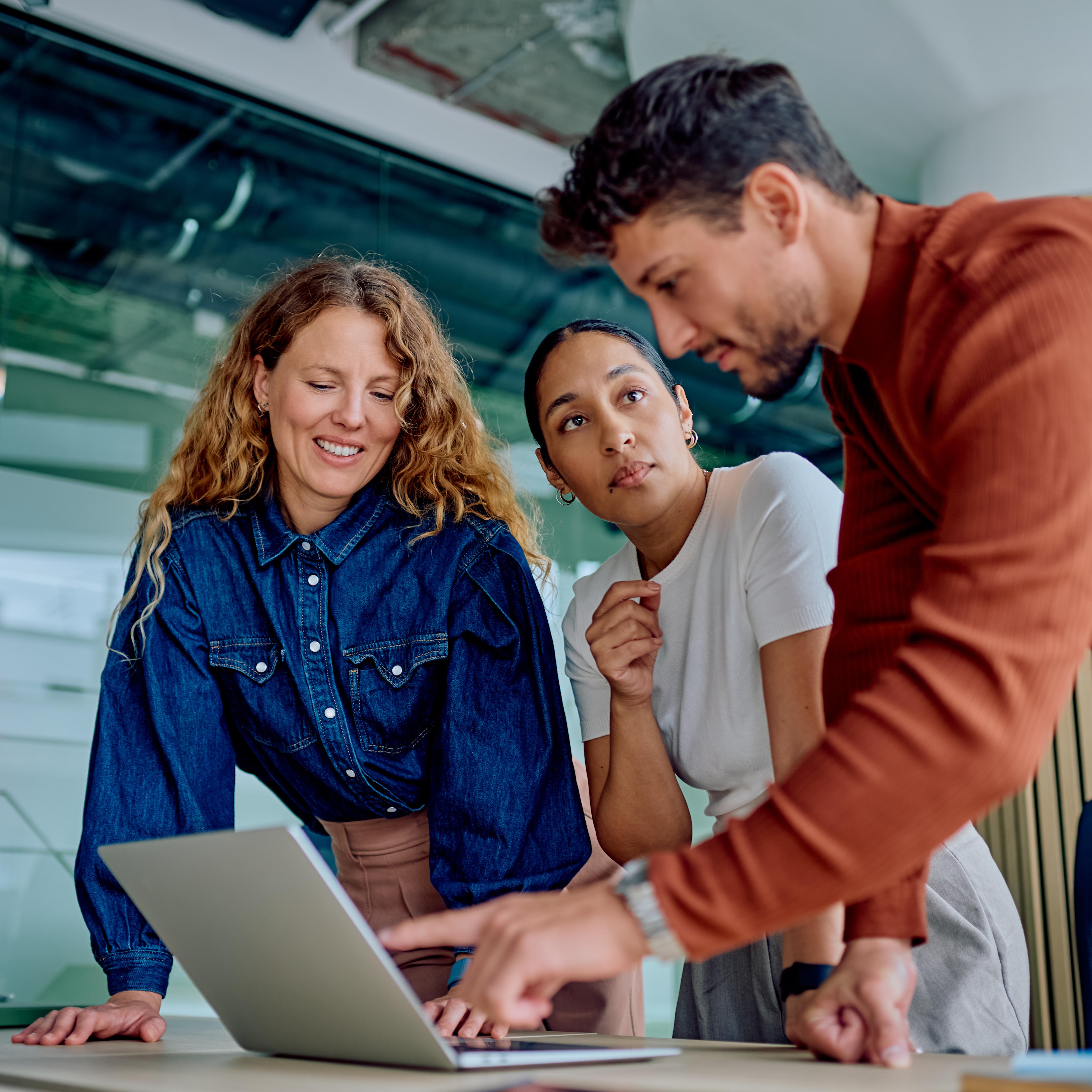 Colleagues reviewing information together on a laptop